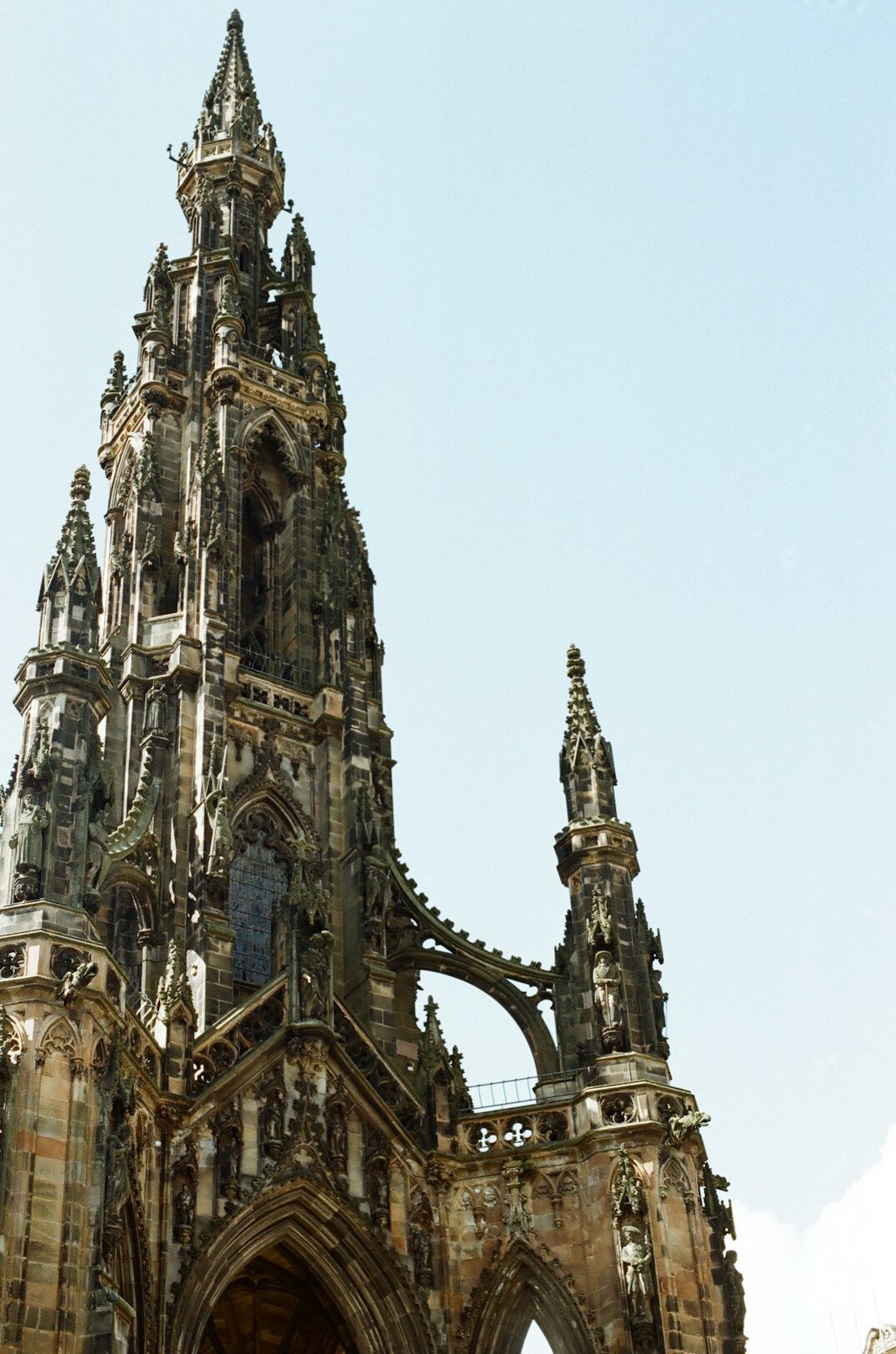 Detail of Gothic cathedral stonework and a spire