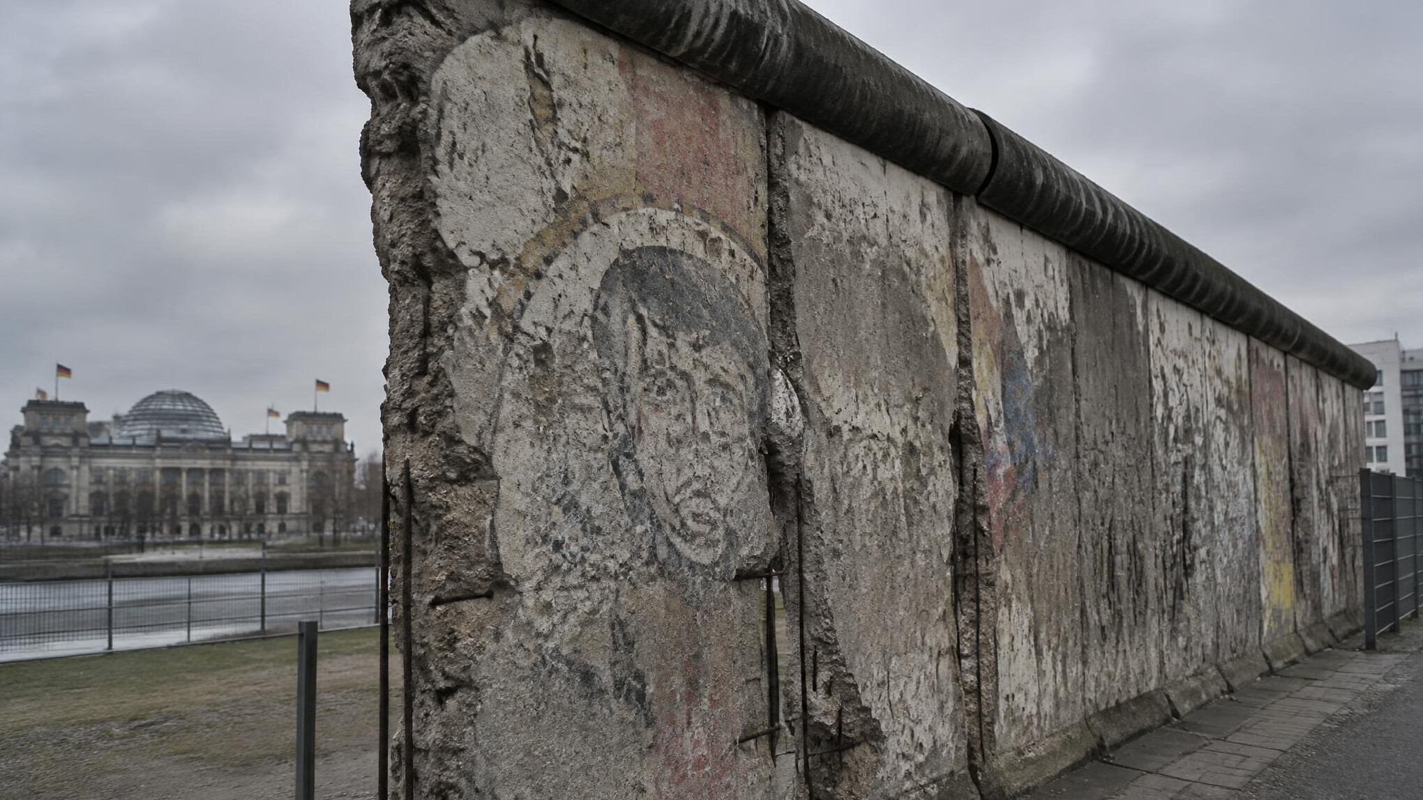 Weathered remaining section of the Berlin Wall