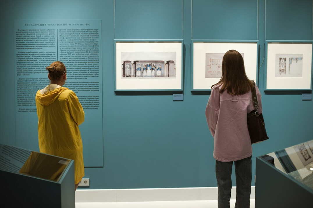Two curators reviewing historical maps together