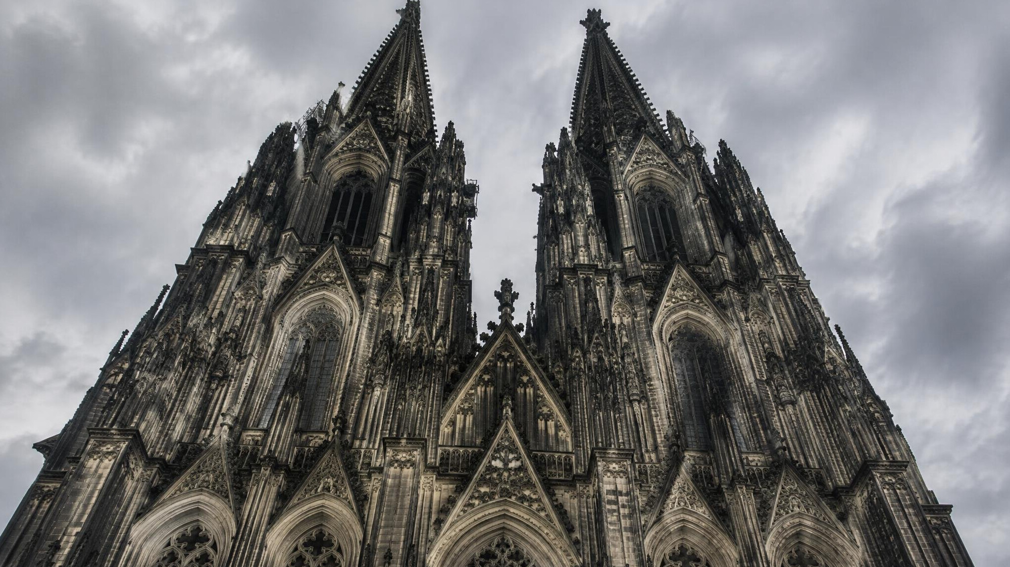 Gothic spires of Cologne Cathedral against an overcast sky